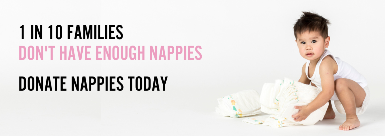 Baby with a bundle of nappies