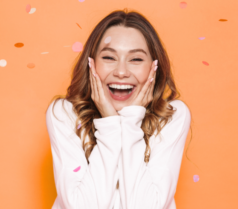 Woman excited with confetti falling