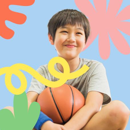 Small boy holding a basketball