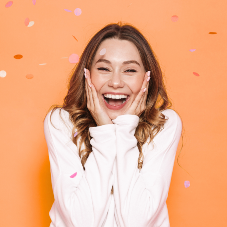 Woman excited with confetti falling