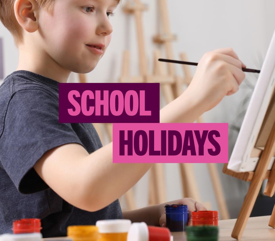 Text 'School Holidays'. With a boy painting a mini canvas on an easel.